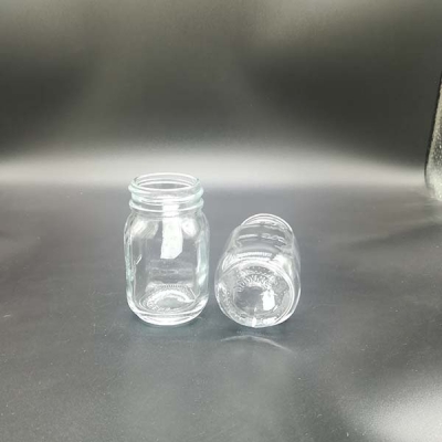 Small glass jar with engraved logo
