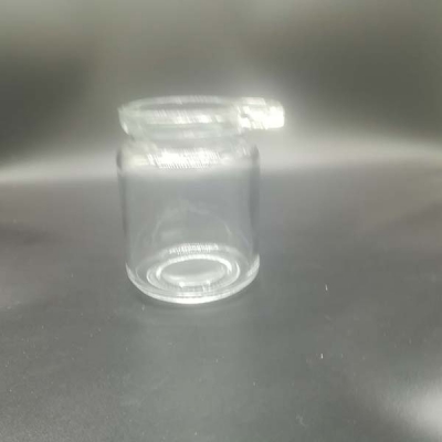 Round glass jar with hand