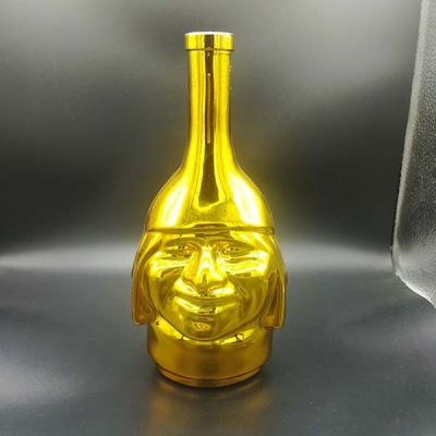 Head shape electraplated wine bottle